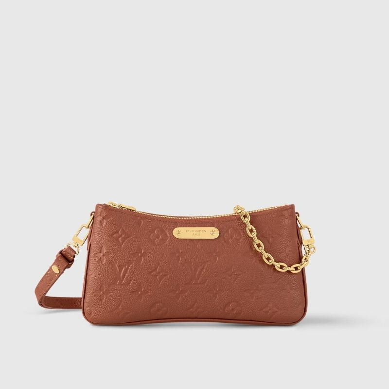 Louis Vuitton Liv Pochette Handbag Monogram Empreinte leather Gold Front View