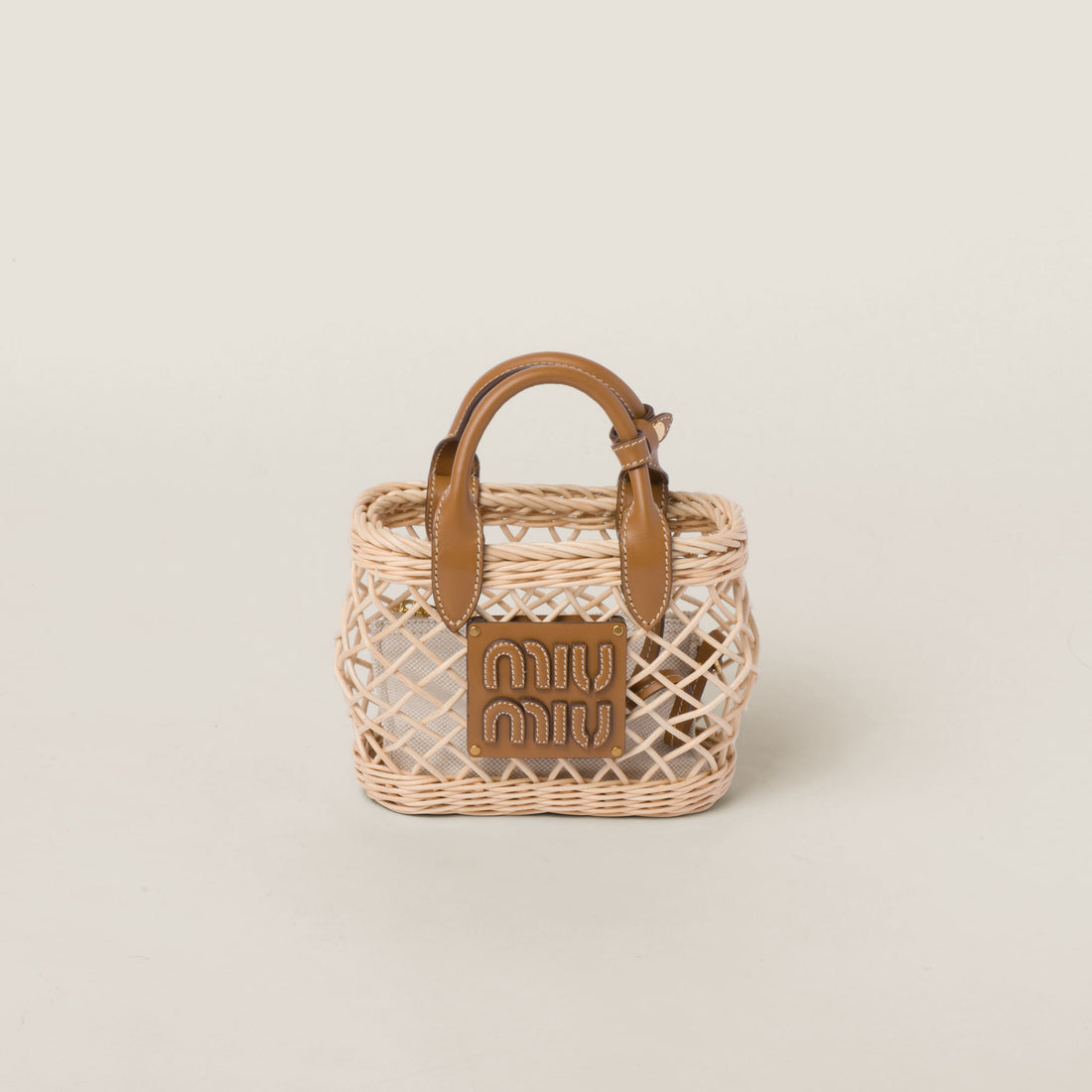 Woven fabric handbag with leather trim