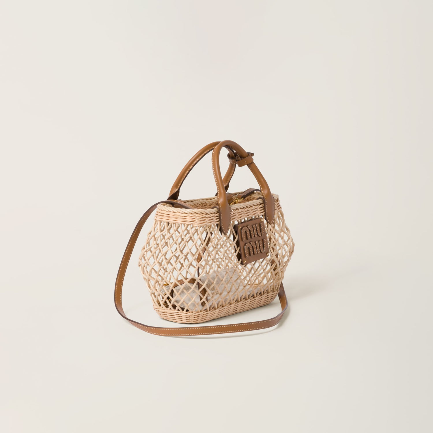 Woven fabric handbag with leather trim