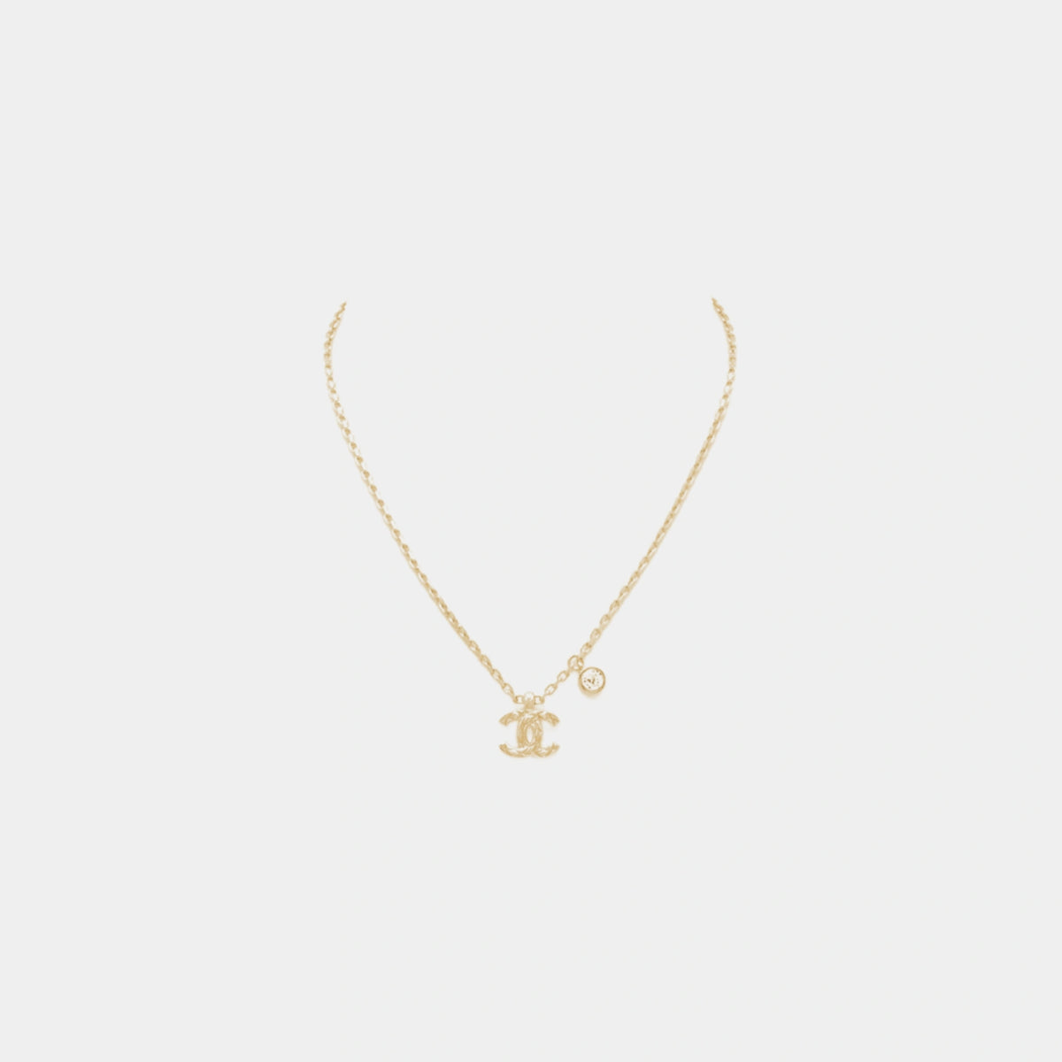 Gold Metal CC Pendant Necklace with Crystal Accent